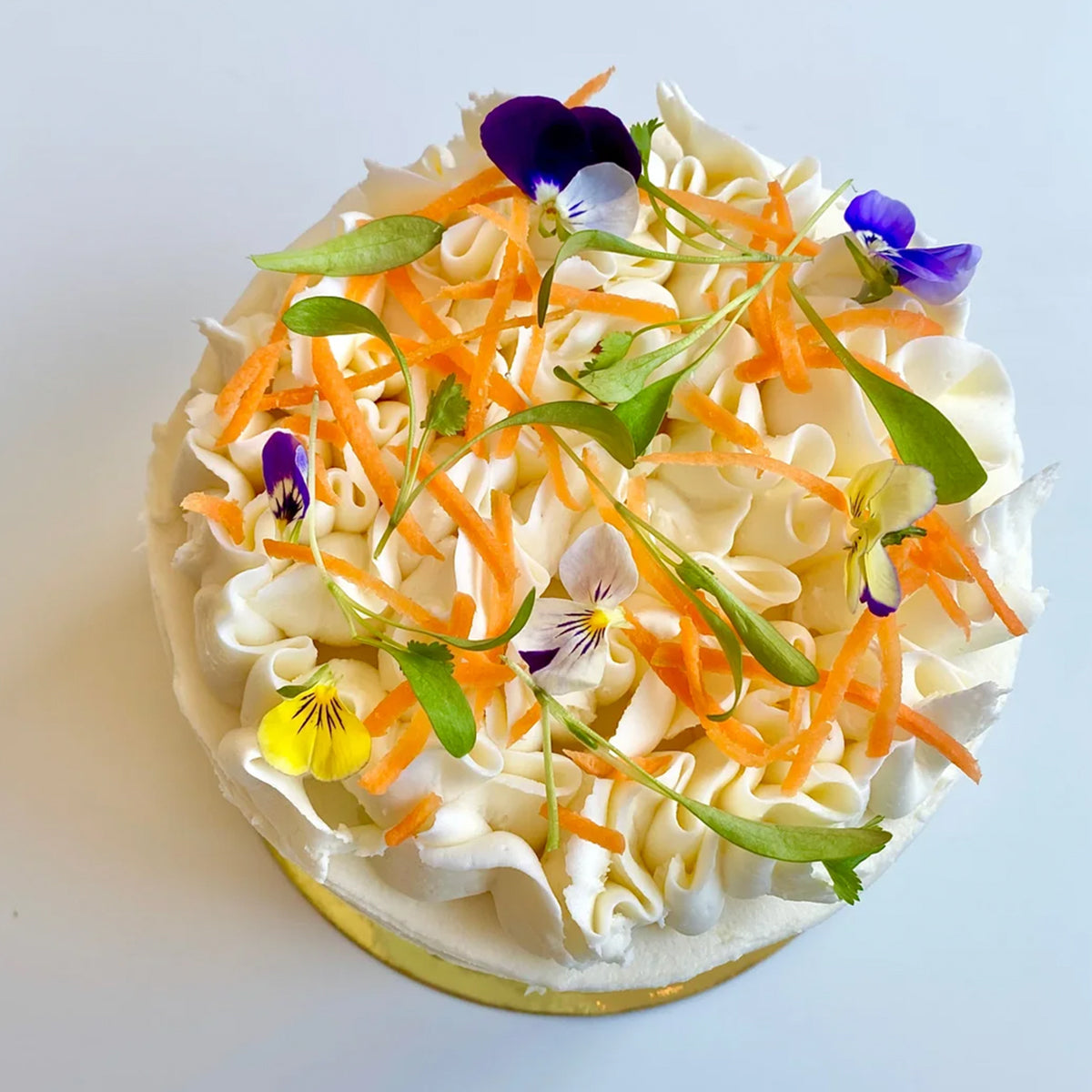 Vegan carrot and cashew-coconut cream mounted cake