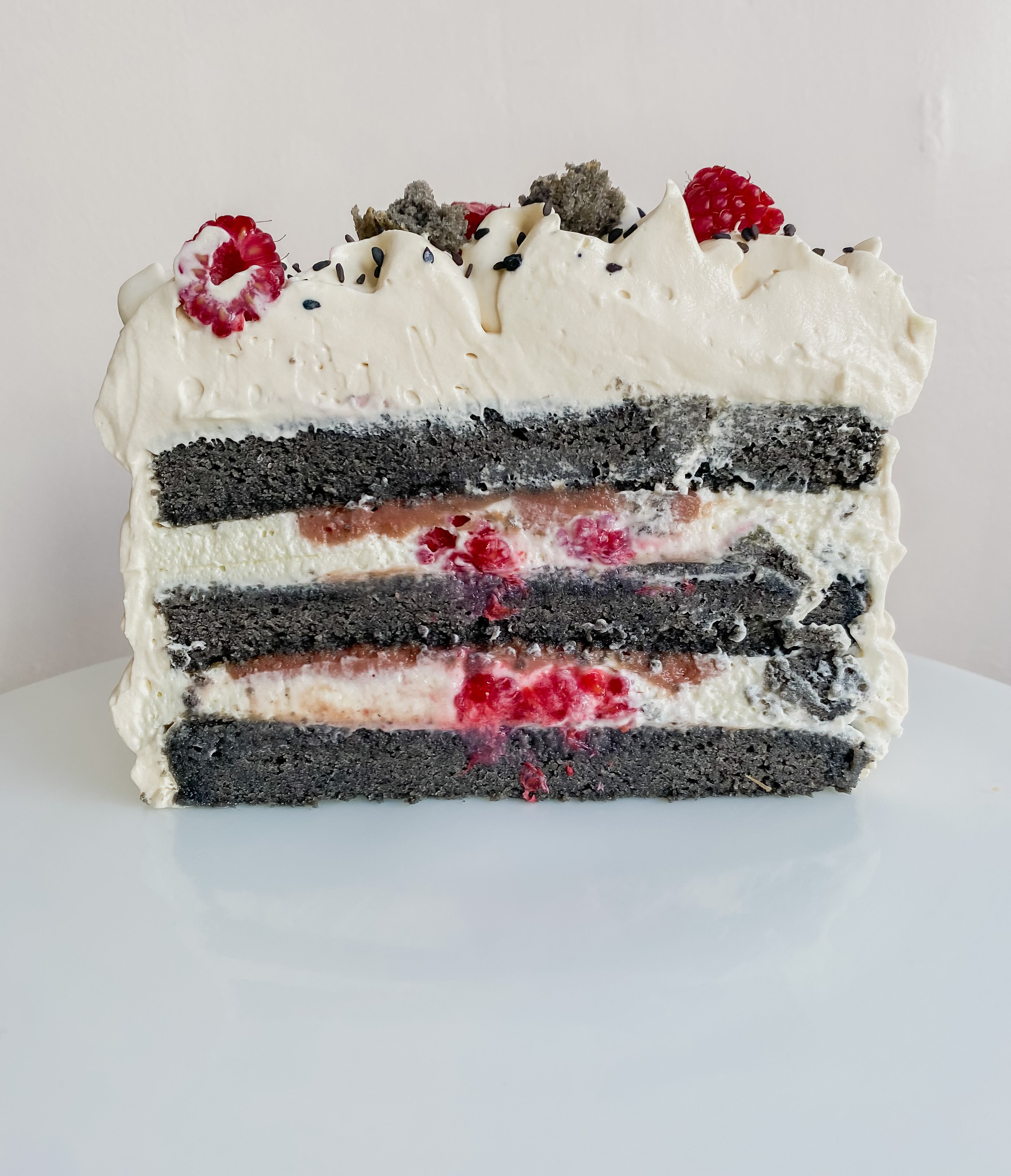 Black sesame, raspberry and caramelized white chocolate mounted cake